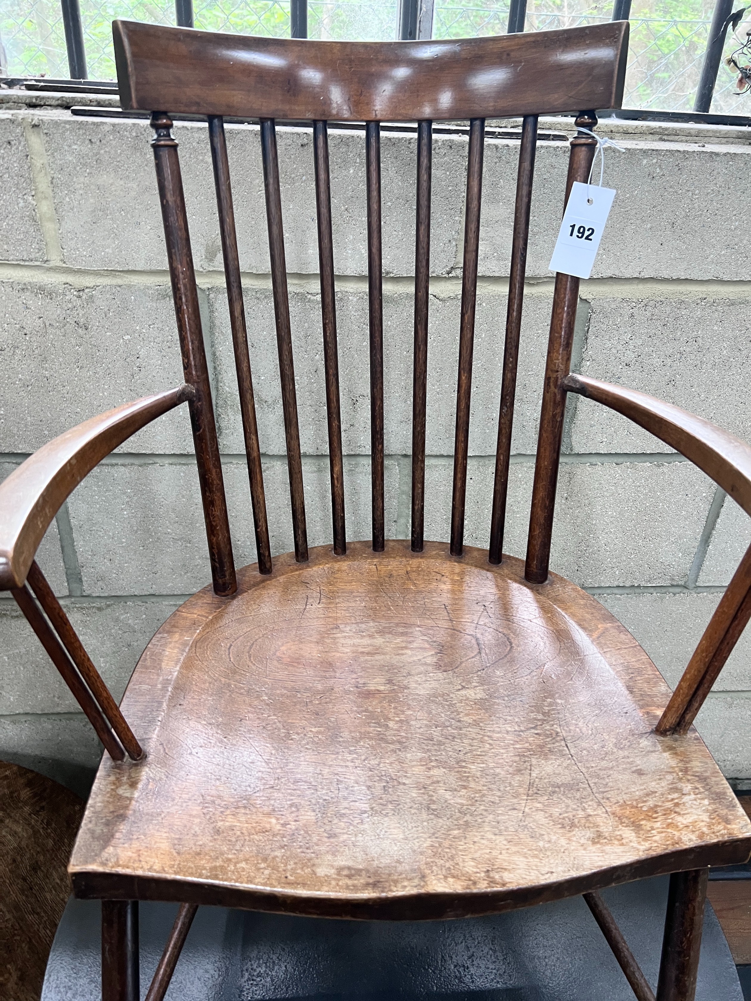 An Arts & Crafts beech Windsor comb back elbow chair, width 49cm, depth 41cm, height 86cm *Please note the sale commences at 9am.